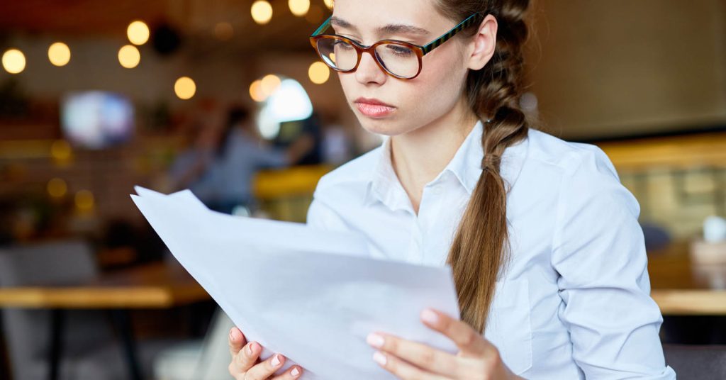 Student reviewing student loan repayment and forgiveness documents