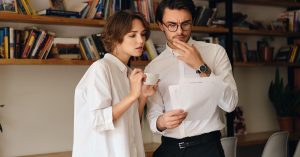 Homeowners reviewing documents while comparing home equity borrowing options