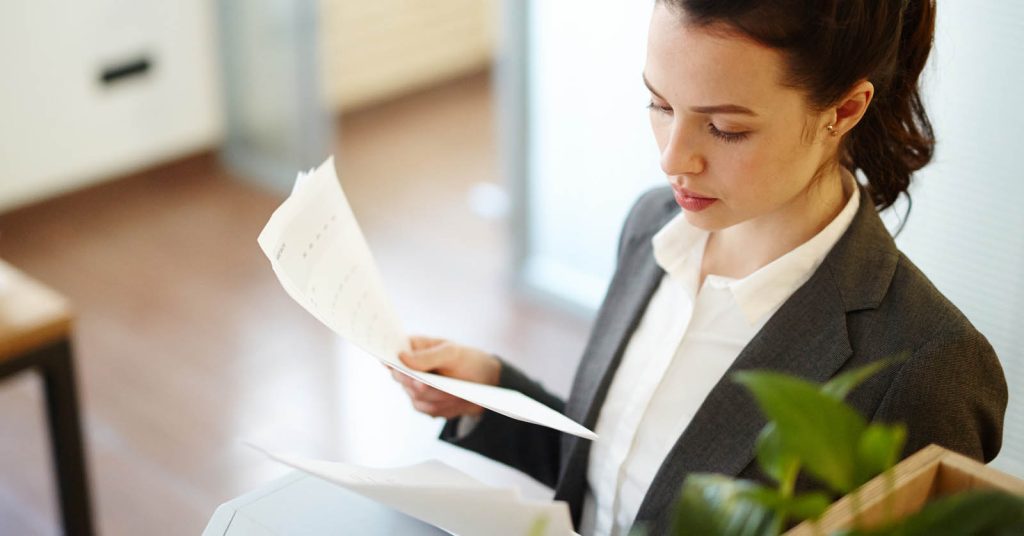 Person reviewing financial papers to decide how much personal loan they can afford