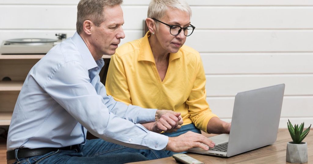 Parents reviewing Parent PLUS loan repayment options on a laptop