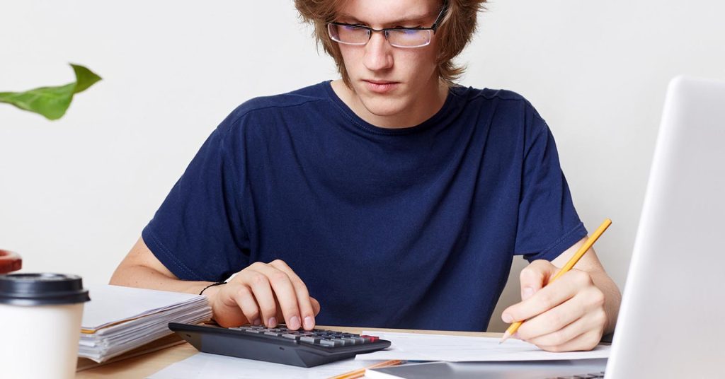 Student reviewing the costs and tradeoffs of private student loans