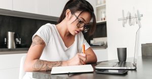 Borrower reviewing federal student loan discharge options and eligibility documents