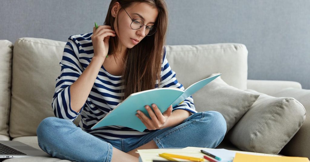 Student reviewing federal student loan forgiveness programs and eligibility requirements