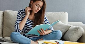 Student reviewing federal student loan forgiveness programs and eligibility requirements