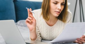 Borrower reviewing student loan refinancing options and loan terms