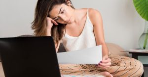 Borrower reviewing defaulted student loan notices and repayment options