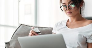 Woman comparing a balance transfer and personal loan for credit card debt