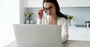 Woman reviewing income and expenses for the bankruptcy means test
