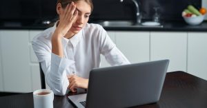 Woman checking what happens to a credit card balance after the account is closed