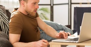 Man reviewing debts that may be discharged in bankruptcy