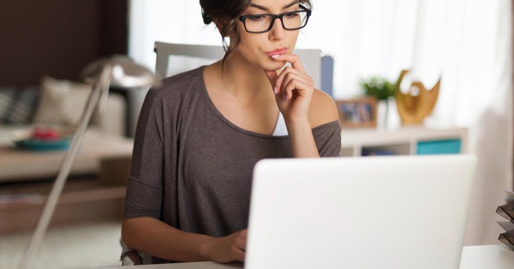 Woman comparing an explanation of benefits with a medical bill