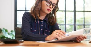 Woman comparing previous bankruptcy records before filing another case