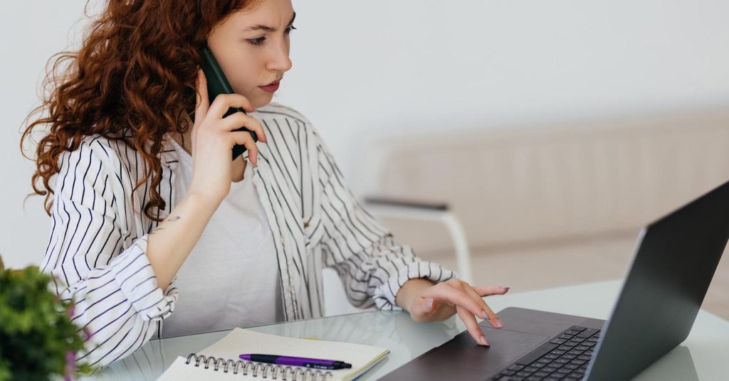 Woman contacting an insurer about an unexpected ground ambulance bill