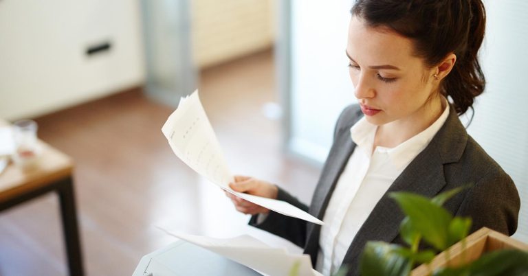 Woman reviewing documents about a hospital lien and medical debt