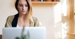 Woman reviewing her credit rebuilding plan after bankruptcy