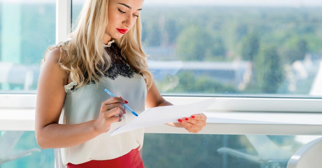 Woman reviewing tax records to determine whether tax debt may be discharged in bankruptcy