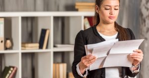 Woman reviewing old debt collection letters