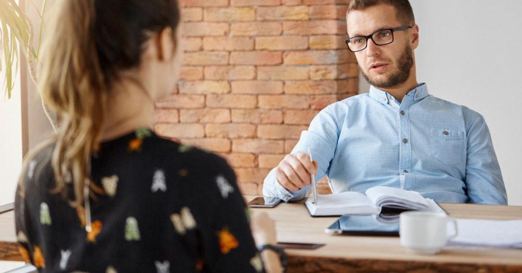 Job candidate discussing salary expectations with an interviewer during a hiring conversation