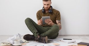 Person comparing side hustle options and planning how to earn extra income