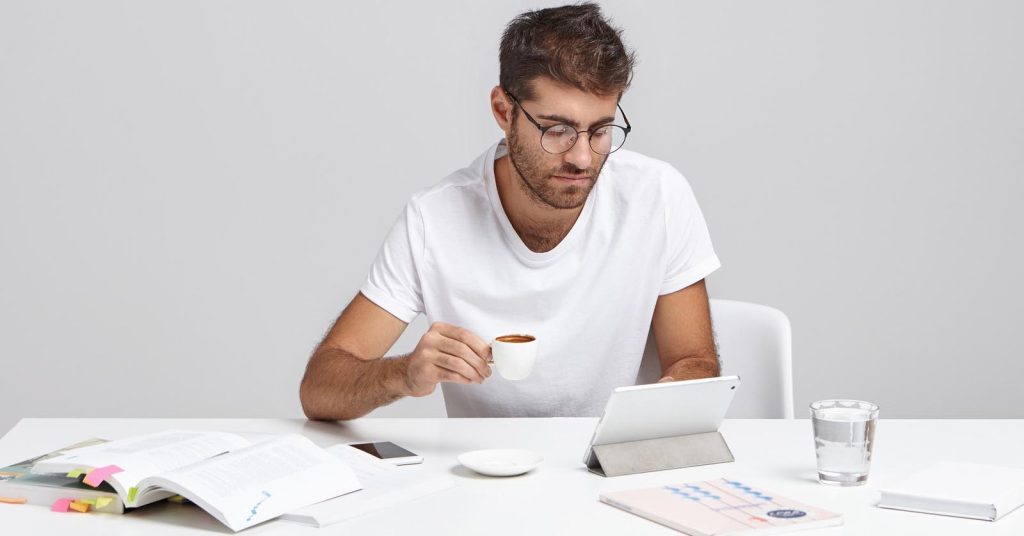Woman comparing documents before applying for a debt consolidation loan