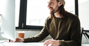 Freelancer comparing online client opportunities while working on a laptop