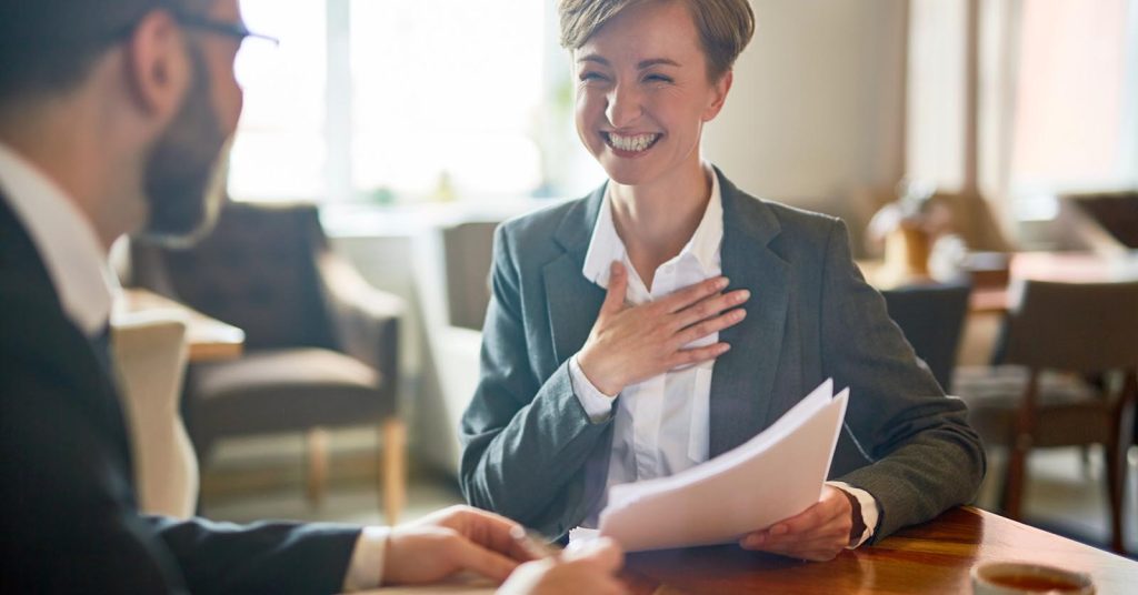 Employee discussing a promotion and career advancement with a manager