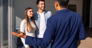 Three people talking inside a home