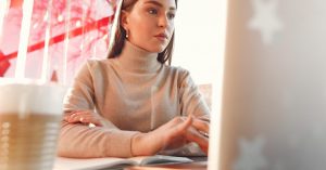 Freelancer reviewing business cash flow and client payments on a laptop