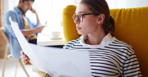 Employee reviewing notes and documents before a performance review