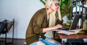 Woman working on a side hustle outside her regular full-time job