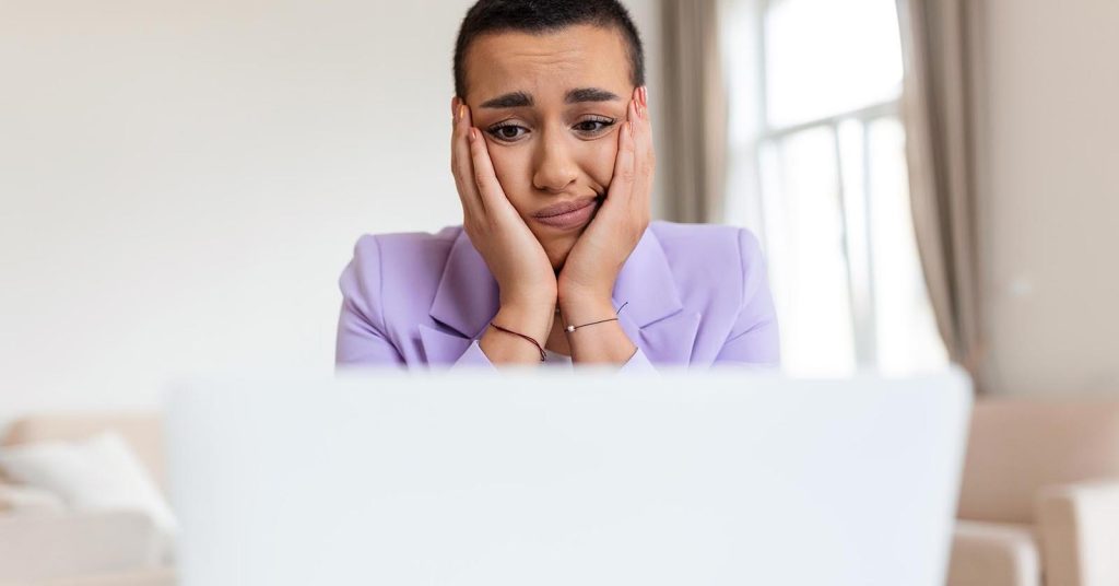 Frustrated woman deciding whether her side hustle is still worth the time and effort