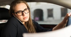Driver reviewing a car insurance cancellation or nonrenewal notice