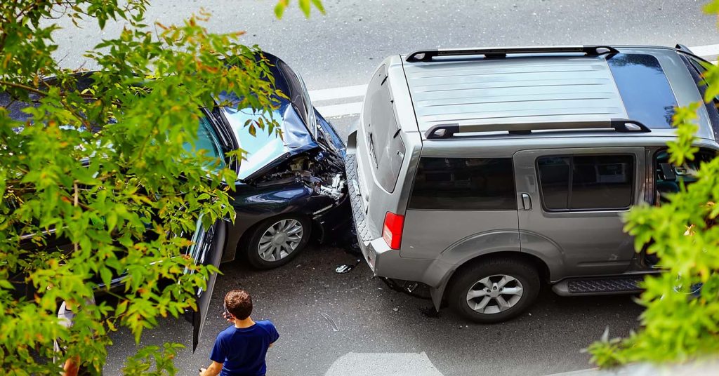 Two vehicles damaged in a collision on a city street