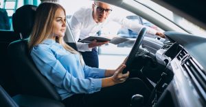 Driver discussing a vehicle appraisal after an accident repair