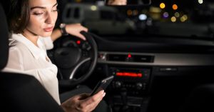 Driver calling for roadside assistance from a parked car at night