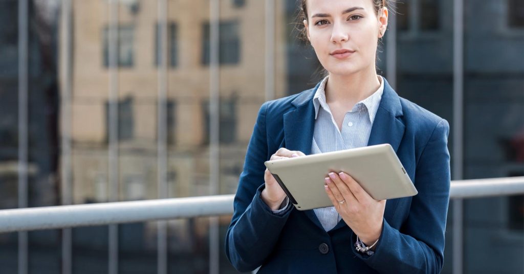 Businesswoman reviewing information on a tablet
