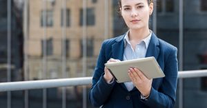 Businesswoman reviewing information on a tablet