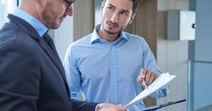 Policyholder reviewing term life insurance documents with an advisor